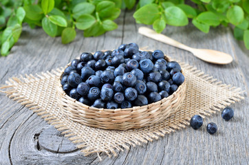 Fresh bilberry in a wicker basket