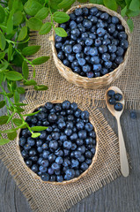 Fresh bilberry in a wicker basket
