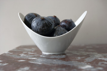 Figs in a White Bowl on a Marble Tabletop