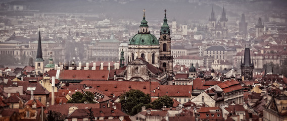 Fototapeta premium Houses with traditional red roofs in Prague. Old Town Square in