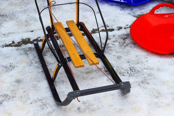 Children sled with metal runners and wooden seat