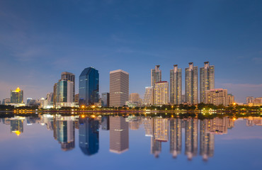 Naklejka premium Bangkok city downtown at night and have water reflection, Bangkok,Thailand