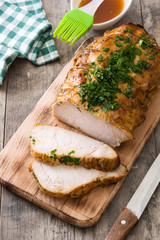 Roasted pork on wooden table
