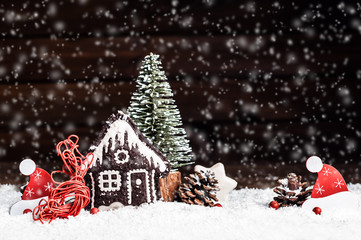 Christmas decorative ornaments on a background of falling snow