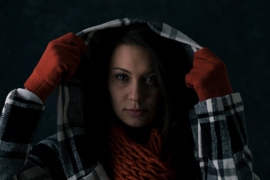 Winter: Woman Pulls Hoodie Up