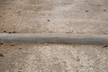 Cement mound on the concrete road