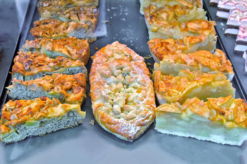 Pieces of fruit cake on a blue tray.