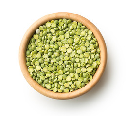 Green split peas in wooden bowl.