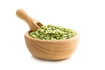 Green split peas in wooden bowl.