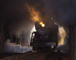 Steam locomotive enters tunnel