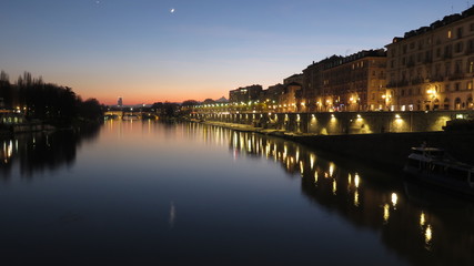 turin and the po river at sunset
