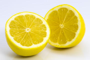 close up of fresh lemon slices on white