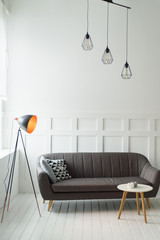 Vintage lamp in a white living room with sofa