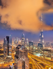 Fototapeta premium Night cityscape of Dubai with modern futuristic architecture , United Arab Emirates