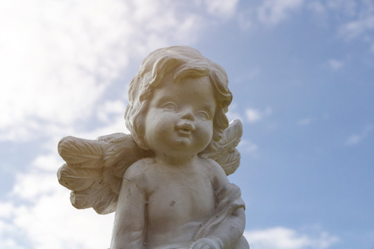 white angel with blue sky