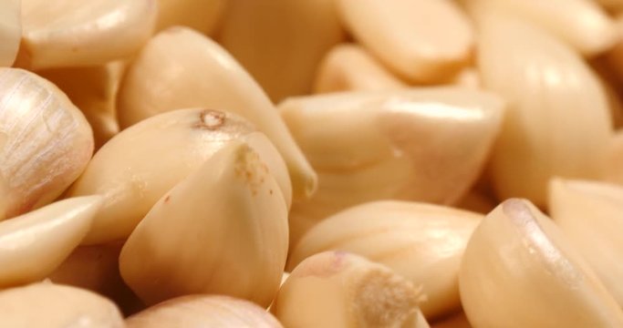 Turning skinned garlic