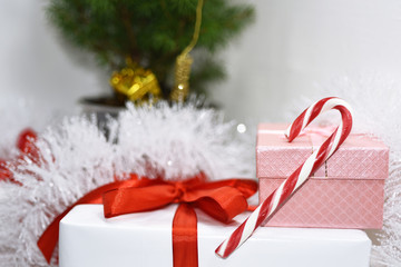 White presents with red ribbons.