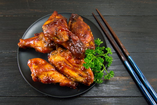 bbq chicken wings and chopsticks