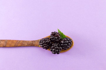 blackberries in a wooden spoon