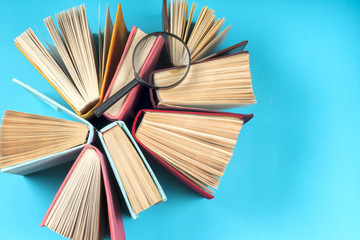 Top view of bright colorful hardback books in a circle.