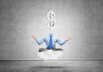 Headless meditating businessman