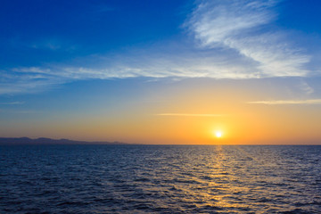 Naklejka na ściany i meble Sunrise over the Strait of Gubal