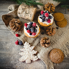 Christmas cupcakes with berries and cookies