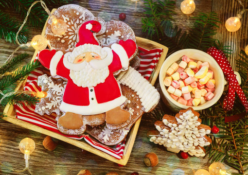 Christmas cookies with Santa Claus in festive decoration