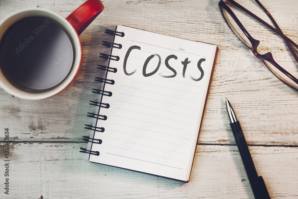 Poster costs text on notebook on working table