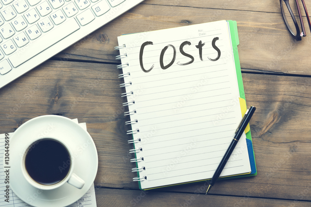 Poster costs text on notebook on working table