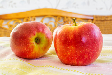 Red apples on a table.