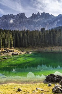 Latemar group reflected in the green waters of Lake Carezza, Ega Valley, South Tyrol Trentino-Alto Adige, Dolomites