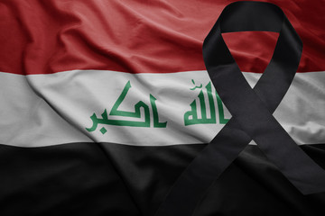 flag of iraq with black mourning ribbon