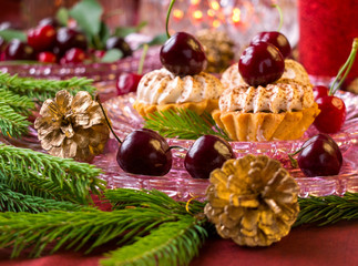 Fototapeta na wymiar Cupcakes with fruits and twig tree - Christmas dessert 