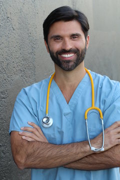 Doctor smiling with his arms crossed