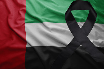 flag of united arab emirates with black mourning ribbon