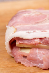 Rolled with bacon stuffed pork chop with yellow cheese