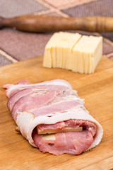 Rolled with bacon stuffed pork chop with yellow cheese