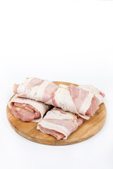 Stuffed pork chop with yellow cheese and rolled in bacon over wh