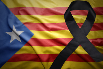 flag of catalonia with black mourning ribbon
