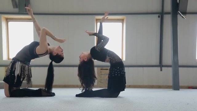 Training of oriental dance in dancing class at mirror.