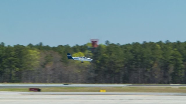 Small Generic Private Airplane Landing at RDU Airport on a Sunny Day at Raleigh-Durham International North Carolina
