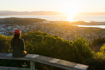 Woman enjoys the view from Centre of New Zealand Walk - 130453420