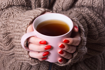 Tea in woman hand