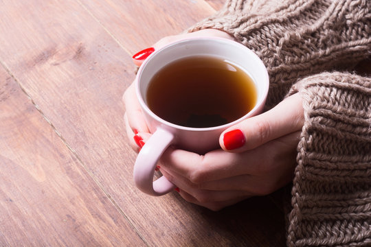 Tea in woman hand