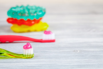 prevention and care children's teeth wooden background top view