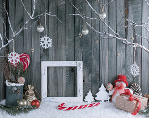 Obraz premium Christmas interior with snowman, photo frame, decorative branche