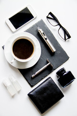 smartphone, electronic cigarette and men's accessories top view