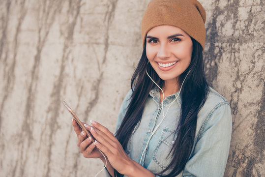 Portrait Of Happy Trendy Hipster Woman  Listening Music On  Phon