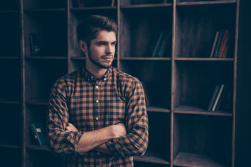 Portrait of serious confident businessman with crossed hands in